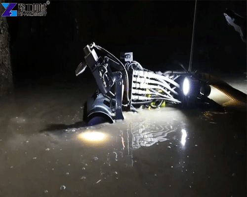 sewer cleaning robot removing thick sludge in confined space